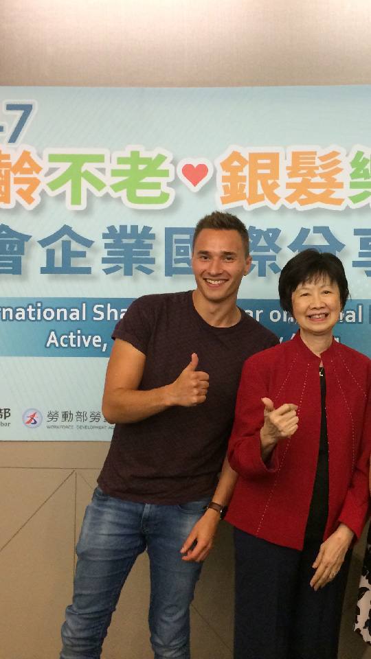 Mark Hendriks with a conference attendee at a Taiwan Ministry of Labor social enterprise event in Hsinchu